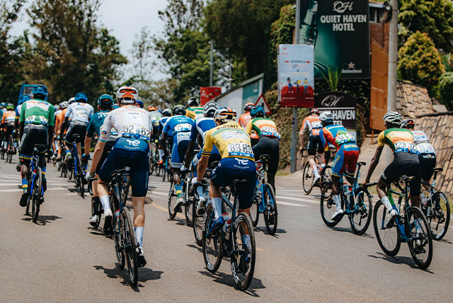 A large number of people biking on a street.